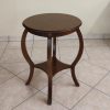 Small round wooden coffee table in walnut fnish